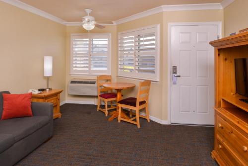 a living room with a couch and a table at Cayucos Beach Inn in Cayucos