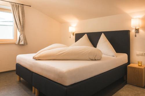 מיטה או מיטות בחדר ב-Villa Mulin im Sommer inklusive Bergbahnticket Super Sommer Card