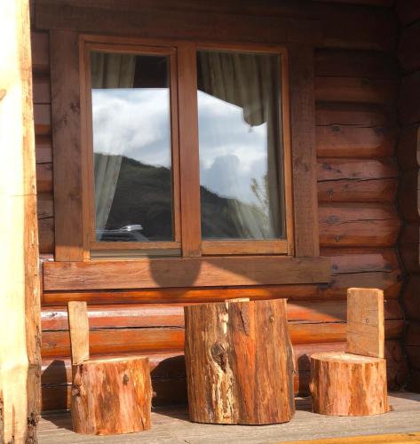 a window on the side of a log cabin at Log home village in Ulverston