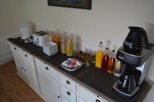 a kitchen counter with a coffee maker on it at Coed-y-Fron in Betws-y-coed