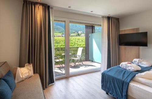 Postel nebo postele na pokoji v ubytování Hotel Christof