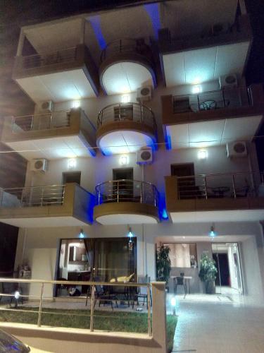 a room with balconies on the ceiling of a building at Villa Konstantinos in Olympiaki Akti