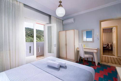 מיטה או מיטות בחדר ב-Villa Vista Al Mar