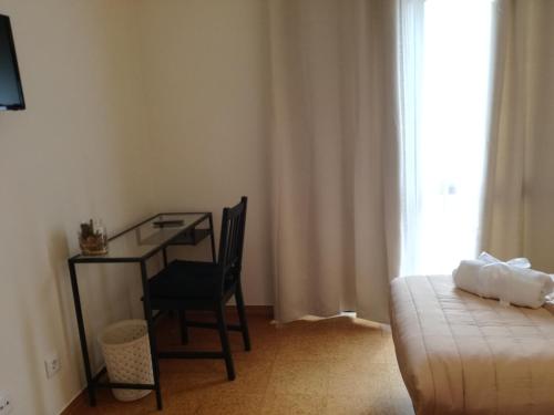 Ένα ή περισσότερα κρεβάτια σε δωμάτιο στο Sensations Guesthouse