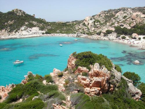 a view of a beach with a boat in the water at Apartment Maria in Tergu