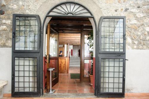 an entrance to a house with a door and windows at Agriturismo Antica Sosta in Viterbo