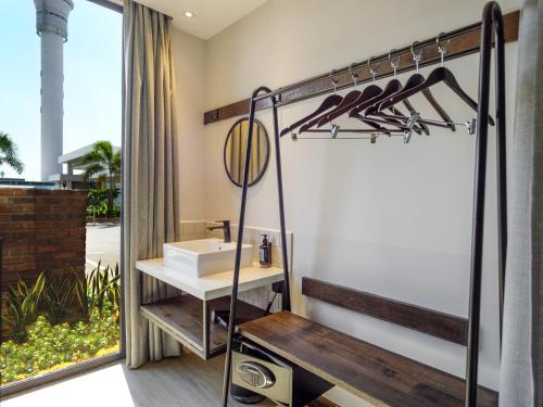 a bathroom with a sink and a mirror at Tune Hotel KLIA-KLIA2, Airport Transit Hotel in Sepang