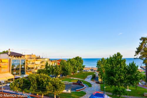 an aerial view of a park next to the ocean at Menios Apartments and Studios in Nea Kalikratia