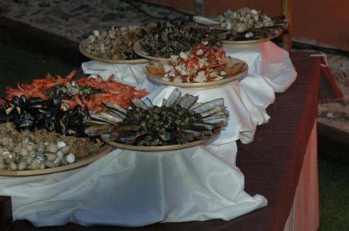 a row of plates of food on a table at Hotel Rio Piedra in Nuévalos