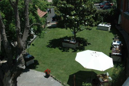 an overhead view of a lawn with an umbrella at Hotel Rio Piedra in Nuévalos