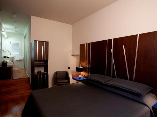 Postel nebo postele na pokoji v ubytování Suite Valadier