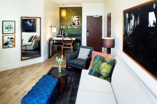 a living room with a couch and a chair at Andaz Savannah, By Hyatt in Savannah