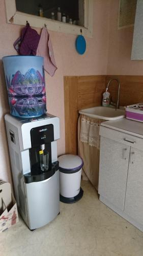 a coffee maker sitting on top of a counter in a kitchen at Apartment on Raisy Okipnoi 5 in Kyiv