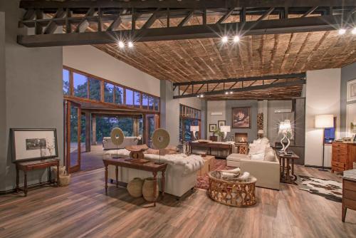 a living room with a couch and a table at Karongwe - Becks Safari Lodge in Hoedspruit