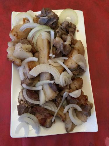 a plate of food with mushrooms and onions at Lilu in Tbilisi City