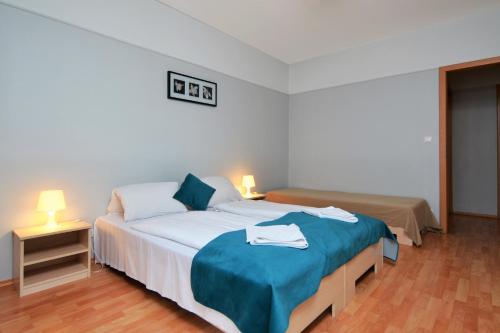 Posteľ alebo postele v izbe v ubytovaní Agape Apartments