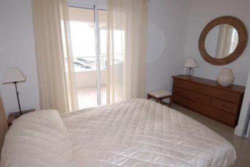 une chambre avec un lit blanc et un miroir dans l'établissement Stunning three bedroom apartment on seafront in Cannes with panoramic sea views 399, à Cannes