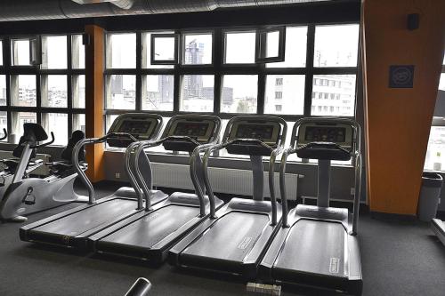 a row of seats in a gym with windows at Sea Towers Gdynia in Gdynia