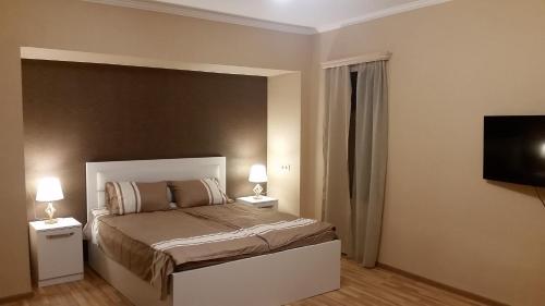 Llit o llits en una habitació de Manana Appartment