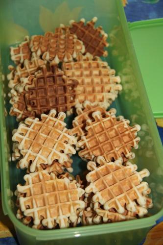 a tray filled with waffles and chocolate chips at Chambres d'hôtes Manoir du Buquet in Honfleur
