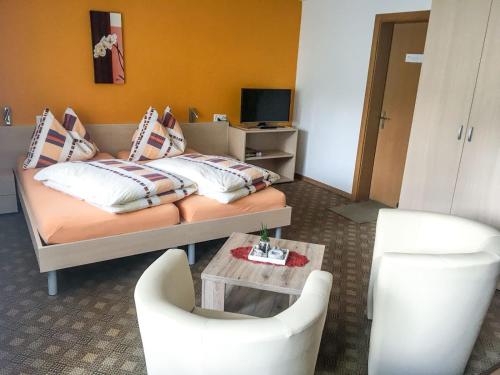 Postel nebo postele na pokoji v ubytování Ferienhaus Perle