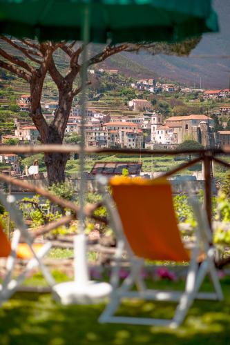 an orange chair sitting on top of a hill at Mimì B&B in Ravello