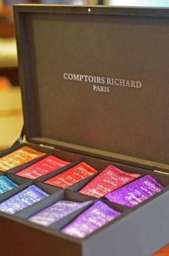 a box of confections highland pens sitting on a table at Central West Hotel in Sofia