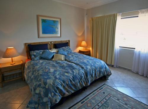 Postel nebo postele na pokoji v ubytování Chala-Kigi Apartments
