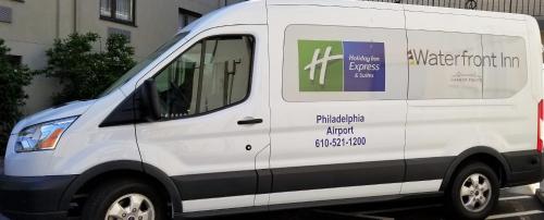 a white van with a sign on the side of it at Waterfront Inn PHL Airport in Essington