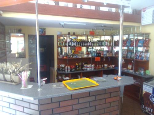 a bar in a store with a lot of alcohol at Ośrodek Wczasowy "GRONOSTAJ" in Rajcza