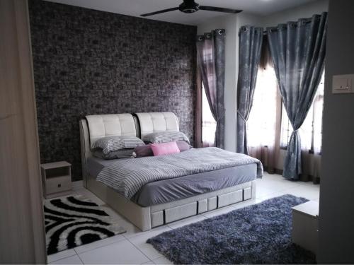 Säng eller sängar i ett rum på Arianna Homestay