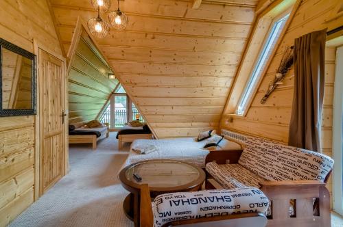 a log cabin with a toilet in a room at Willa Doris in Zakopane