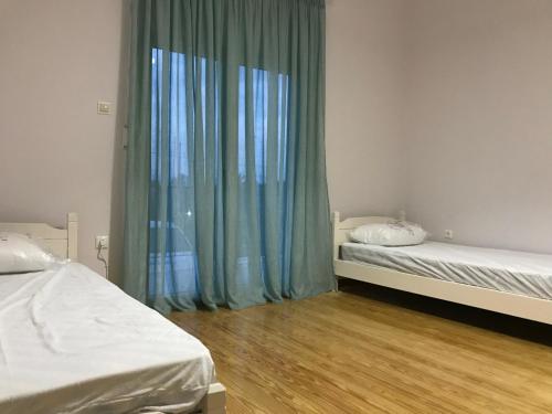 מיטה או מיטות בחדר ב-Villa Filoxenia