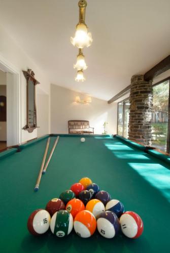 a pool table with a bunch of balls on it at Barradas Parque Hotel & Spa in Punta del Este