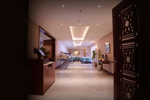 a hallway of a salon with a waiting room at Warwick Al Khobar in Al Khobar