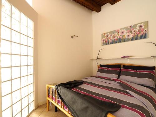 Кровать или кровати в номере Appartamento al Duomo