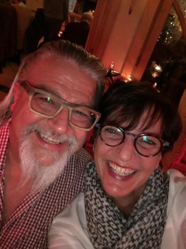 a man and a woman posing for a picture at Hotel Garni Eder in Gmund am Tegernsee
