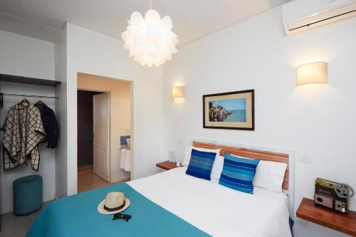 Postel nebo postele na pokoji v ubytování L'Adresse Hôtel Boutique