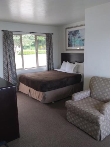 Ένα ή περισσότερα κρεβάτια σε δωμάτιο στο Bay Bridge Motel