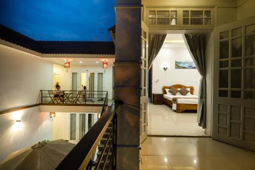 Postel nebo postele na pokoji v ubytování Horizon Homestay Hoi An