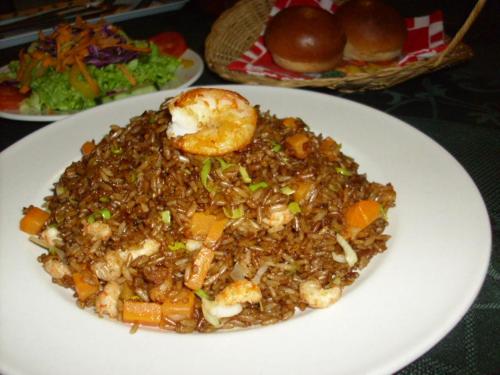 a white plate of food on a table at Rainbow Village in La Ceiba