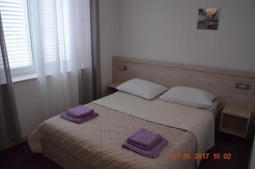 Ένα ή περισσότερα κρεβάτια σε δωμάτιο στο Apartment Daniela