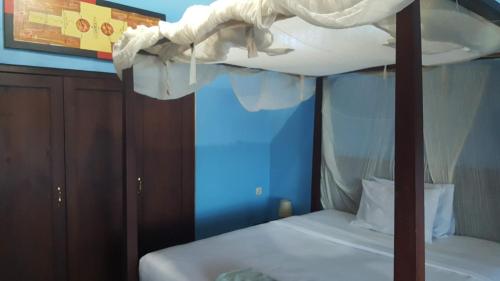 Ένα ή περισσότερα κρεβάτια σε δωμάτιο στο Aman Gati Hotel Lakey
