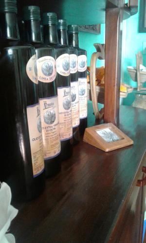 a group of bottles of wine sitting on a table at Agriturismo Nonni Devia in Lucinasco