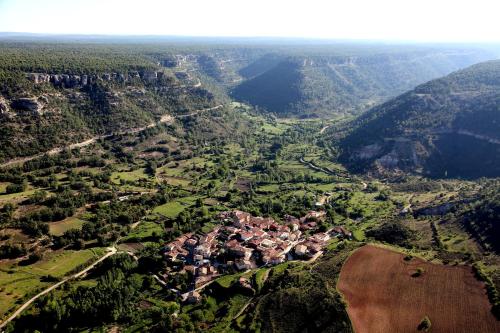 an aerial view of a village in the mountains at Ciudad Encantada Tio Daniel in Valdecabras
