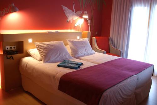 Tempat tidur dalam kamar di Hotel Ritual El Palmar-Adults Only