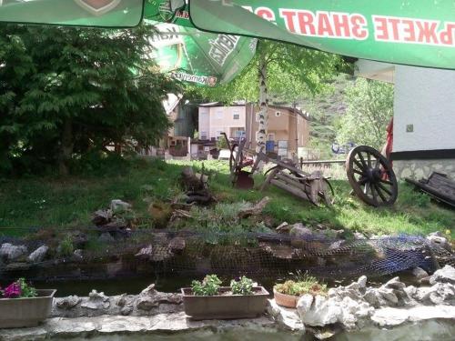 a model of a farm with a tractor and a creek at Apartment Suzana in Mavrovo