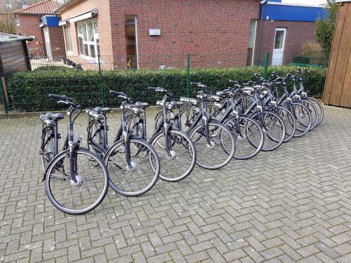 a row of bikes parked in a row at Hotel Restaurant Clemens-August in Ascheberg