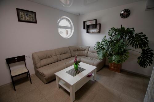 a living room with a couch and a table at Апартаменти Маяк in Odesa