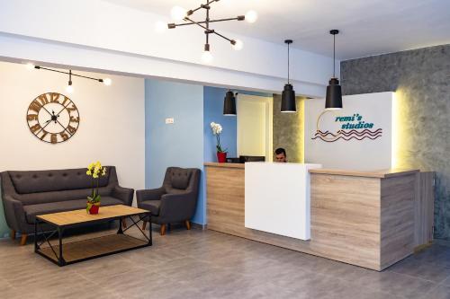 a waiting room at a dental clinic with chairs and a counter at Remis Studios in Rethymno Town